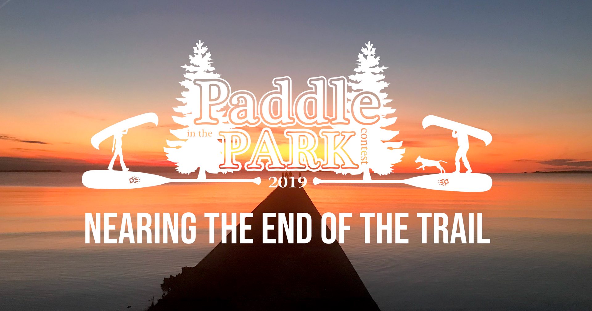 Nearing the End of the Trail text with Paddle in the Park Contest logo overlay on a long dock leading to water with a sunset background