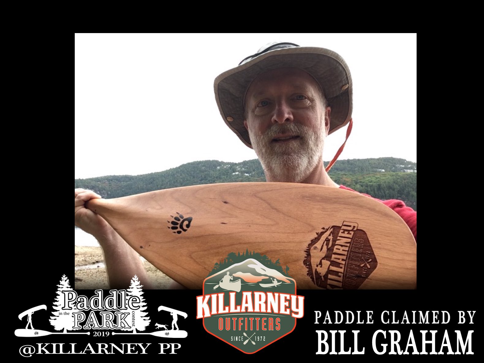Bill Graham holding a Badger LaBonga paddle - winner of the Killarney Outfitter canoe paddle and prize package he won from the Paddle in the Park Contest